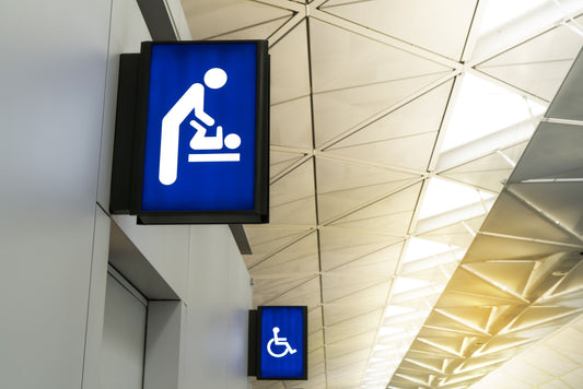 Public restroom sign showing that there is a baby changing station. 