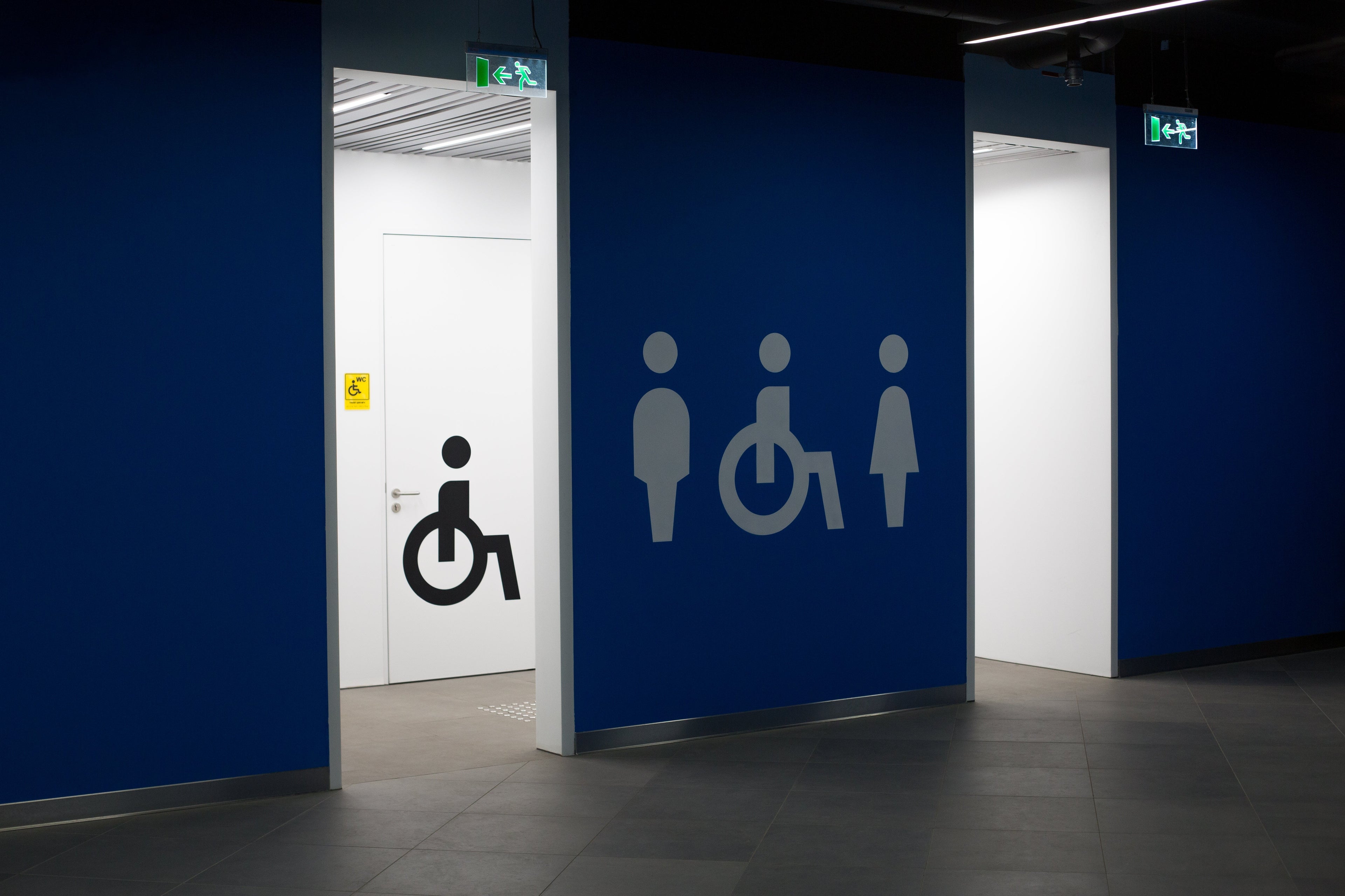 Accessible bathroom entrance with signage.
