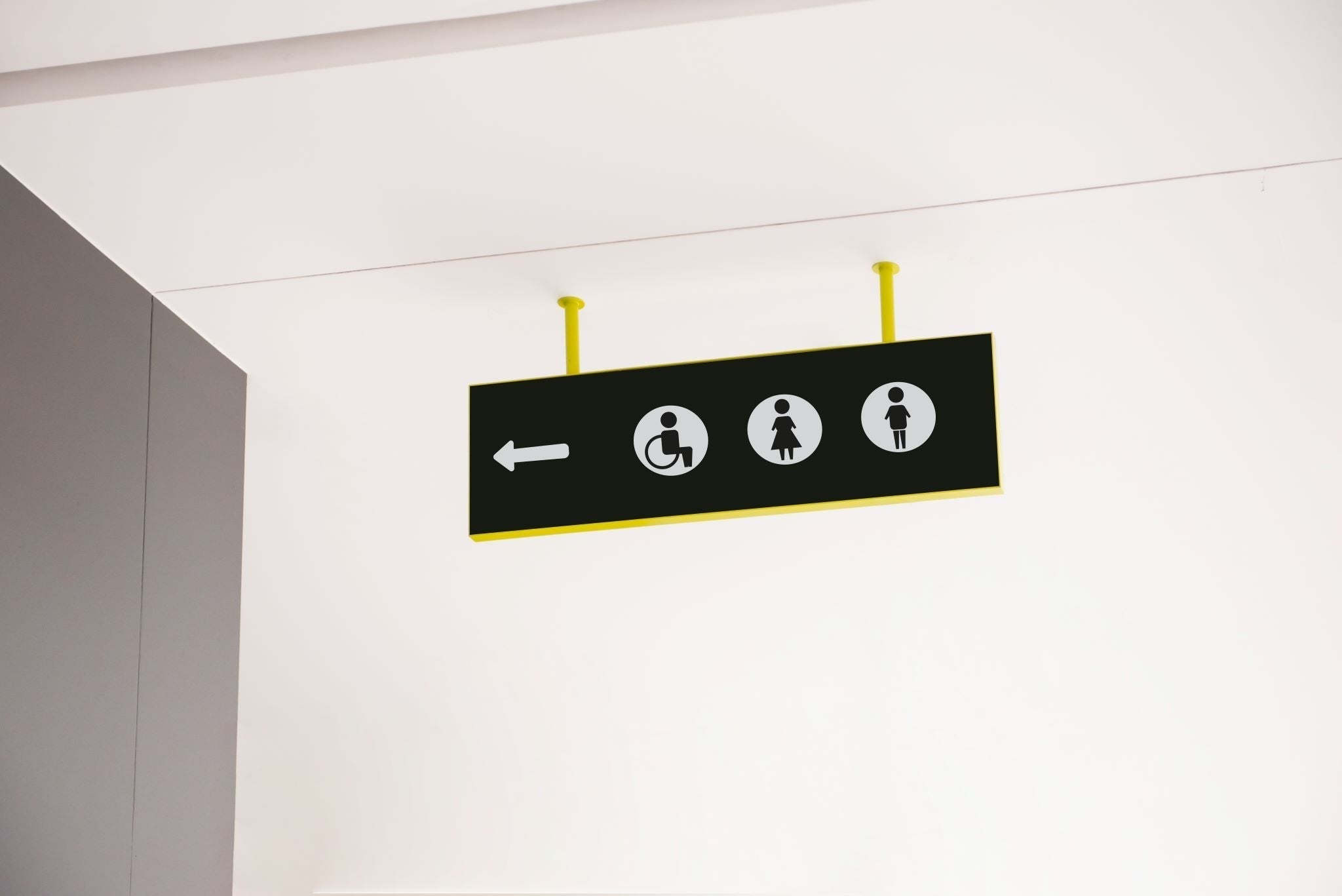 Sign directing towards handicap restroom