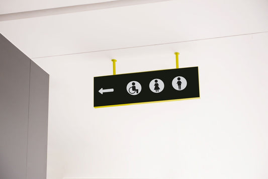 Sign directing towards handicap restroom