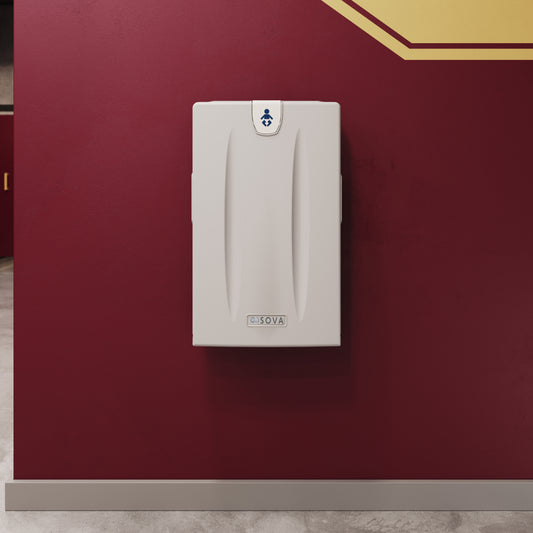 White Origin Vertical Baby Changing Station wall-mounted against a red wall with a gold trim.