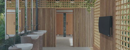 Accessible bathroom interior with wooden walls, sinks, and Sova Element Baby Changing Station