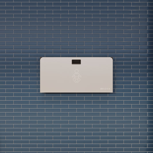 Aura Horizontal Baby changing station mounted on brick wall