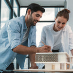 Two architects working on accessible bathroom plans